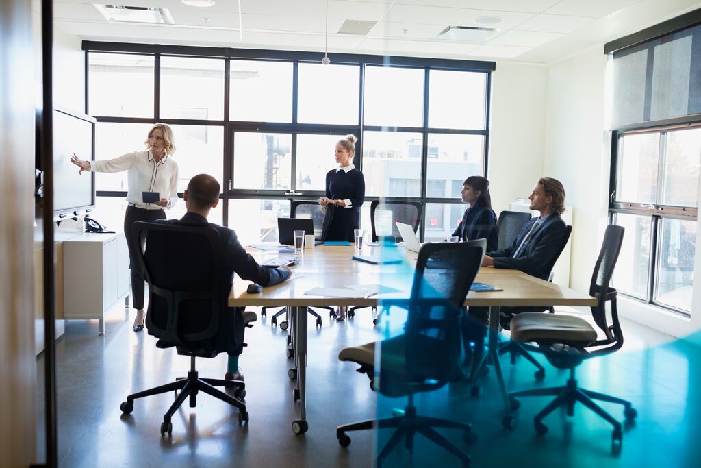 Businesswoman leading a meeting in a conference room